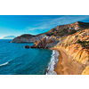 Agios Ioannis greek beach and Aegean sea on sunset. Milos island, Greece