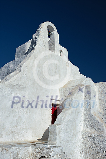 Famous tourist landmark of Greece - Greek Orthodox Church of Panagia Paraportiani in town of Chora on Mykonos island, Greece on sunrise