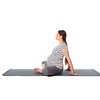 Pregnancy yoga exercise - pregnant woman doing asana Baddha Konasana Bound Angle Pose isolated on white background