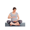 Pregnancy yoga exercise - pregnant woman doing asana Sukhasana easy yoga pose embracing her belly isolated on white background