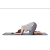 Pregnancy yoga exercise - pregnant woman doing asana Balasana - child s pose isolated on white background