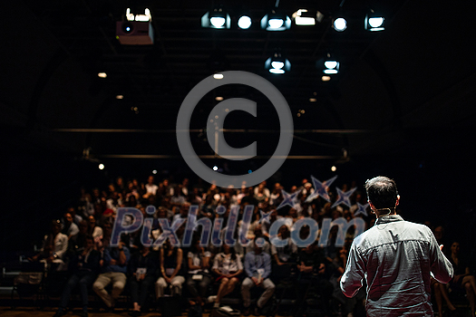 Speaker giving a talk on corporate Business Conference. Audience at the conference hall. Business and Entrepreneurship event. Speaker giving a talk on corporate Business Conference. Audience at the conference hall. Business and Entrepreneurship event.