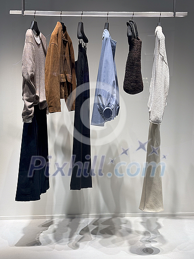 Stylish shop window with designer fashion clothes Stylish shop window with designer fashion clothes