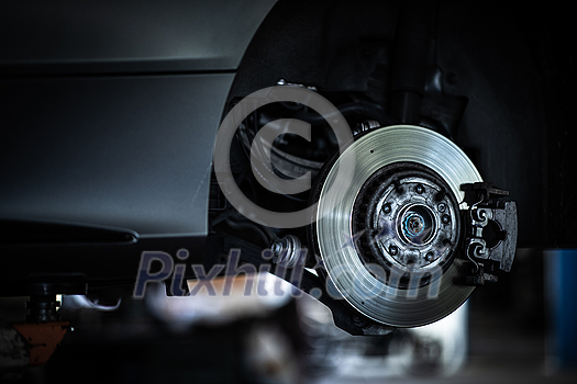 Tyre change - wheel balancing or repair and change car tire at auto service garage or workshop by mechanic Tyre change - wheel balancing or repair and change car tire at auto service garage or workshop by mechanic