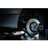 Tyre change - wheel balancing or repair and change car tire at auto service garage or workshop by mechanic