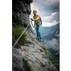 Young, male climber on a via ferrata route - climbing on a rock in Swiss Alps