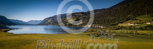 The panorama with Kitzsteinhorn(Tauern Alps) and Zell am See in the Zell am See-Kaprun region, Austrian Alps, Salcburgerland