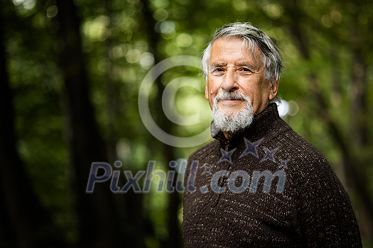 Elderly caucasian male walking outdoors on an autumn, fall day Elderly caucasian male walking outdoors on an autumn, fall day