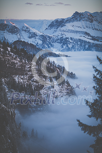 Splendid apline scenery. High mountains with fog and lovely evening light. Splendid apline scenery. High mountains with fog and lovely evening light.