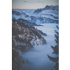 Splendid apline scenery. High mountains with fog and lovely evening light.