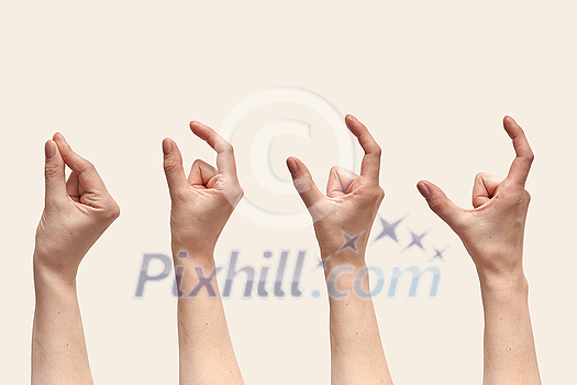Multiple female hand making the symbol that measuring or size with fingers isolated on beige background. Set with hand fingers open in steps. Multiple female hand making the symbol that measuring or size with fingers isolated on beige background. Set with hand fingers open in steps.