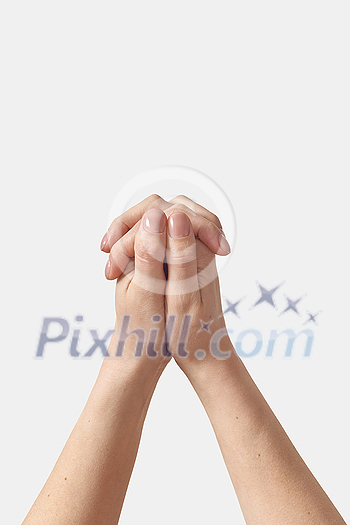 Female hands folded into a lock, protection, gentle care something hidden inside with two manicured thumbs on top isolated on white background. Female hands folded into a lock, protection, gentle care something hidden inside with two manicured thumbs on top isolated on white background.