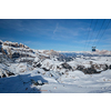 View of a ski resort piste with people skiing in Dolomites in Italy with cable car ski lift. Ski area Arabba. Arabba, Italy