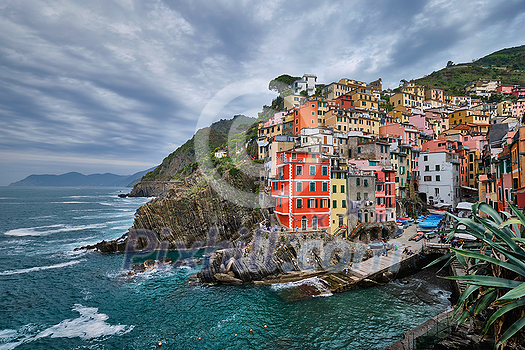 Riomaggiore village popular tourist destination in Cinque Terre National Park a UNESCO World Heritage Site, Liguria, Italy in stormy weather Riomaggiore village popular tourist destination in Cinque Terre National Park a UNESCO World Heritage Site, Liguria, Italy in stormy weather