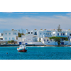 The beach and fishing village of Pollonia with fishing boats in sea. Pollonia town, Milos island, Greece