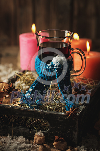 Christmas hot mulled wine with orange, cinnamon, cardamom and anise on wooden background Christmas hot mulled wine with orange, cinnamon, cardamom and anise on wooden background