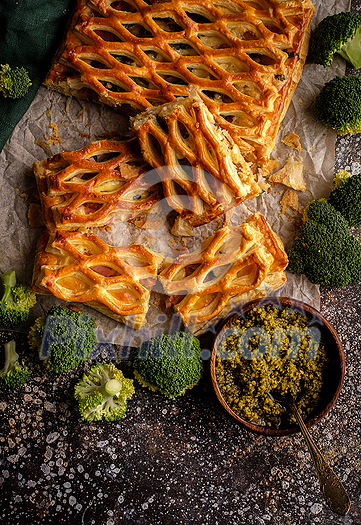 Chicken pie with broccoli from puff pastry top view. Chicken pie with broccoli from puff pastry top view.