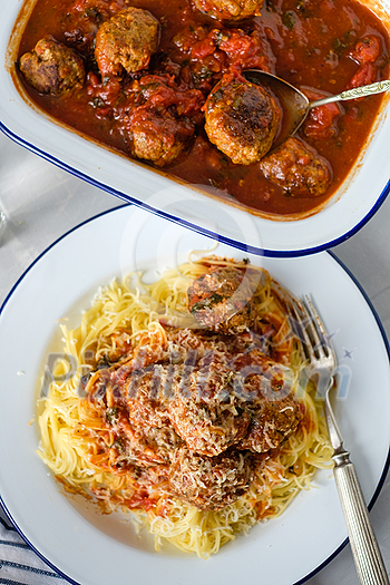 Delicious homemade meat balls in tomato sauce with spaghetti. Top view. Delicious homemade meat balls in tomato sauce with spaghetti. Top view.