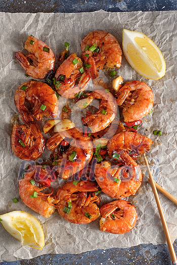 Large grilled BBQ shrimp with sweet chili sauce, green onion and lemon Large grilled BBQ shrimp with sweet chili sauce, green onion and lemon