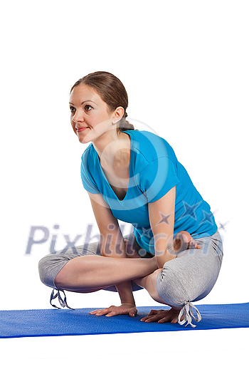 Yoga - young beautiful woman yoga instructor doing Cock Pose (Rooster Posture) (Kukkutasana) asana exercise isolated on white background Yoga - young beautiful woman yoga instructor doing Cock Pose (Rooster Posture) (Kukkutasana) asana exercise isolated on white background