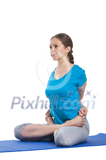 Yoga - young beautiful woman yoga instructor doing bound lotus pose (Baddha Padmasana) exercise isolated on white background Yoga - young beautiful woman yoga instructor doing bound lotus pose (Baddha Padmasana) exercise isolated on white background
