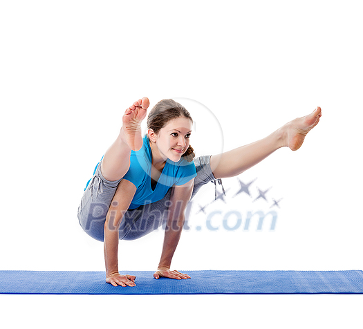 Yoga - young beautiful woman yoga instructor doing Firefly asana pose (Titibasana) exercise isolated on white background Yoga - young beautiful woman yoga instructor doing Firefly asana pose (Titibasana) exercise isolated on white background