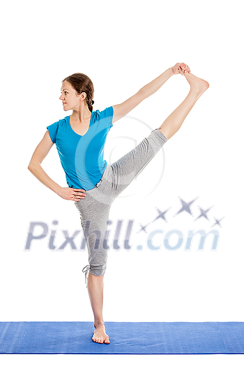 Yoga - young beautiful slender woman yoga instructor doing Extended Hand-To-Big-Toe Pose (Utthita Hasta Padangustasana) asana exercise isolated on white background Yoga - young beautiful slender woman yoga instructor doing Extended Hand-To-Big-Toe Pose (Utthita Hasta Padangustasana) asana exercise isolated on white background