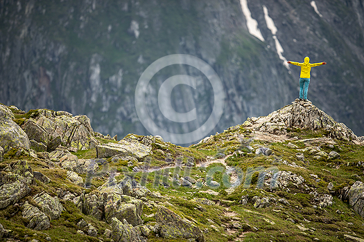 Young woman admiring the natural beauty of a glacier in the Swiss Alps. Europe Young woman admiring the natural beauty of a glacier in the Swiss Alps. Europe