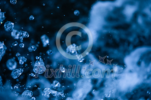 Water concept - river water flowing with light reflecting of its surface - long exposure shot