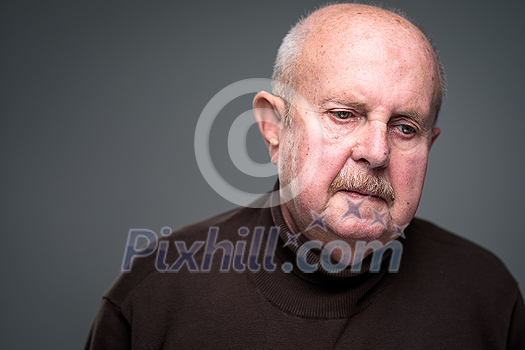 Senior man lonely at home, anxious/afraid to go out - self isolation/ quarantine due to COVID-19/ Coronavirus social distancing/prevention concept