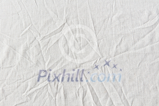 Natural crumpled white linen textile background. Hypoallergenic material used for bedclothes. Natural crumpled white linen textile background. Hypoallergenic material used for bedclothes.