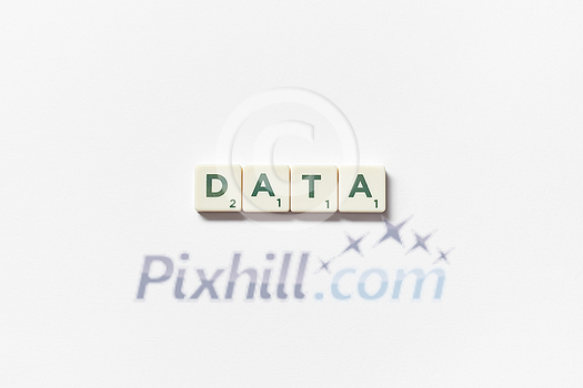 Data word formed of scrabble tiles on white background. Creative template with copy space. Data word formed of scrabble tiles on white background. Creative template with copy space.