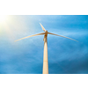 Green renewable alternative energy concept - wind generator turbine generating electricity in blue sky