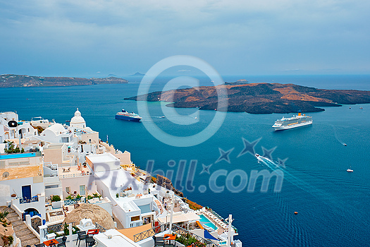 View of Fira Greek town with traditional white houses on Santorini island with cruise ships in sea. Santorini, Greece View of Fira Greek town with traditional white houses on Santorini island with cruise ships in sea. Santorini, Greece