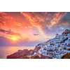 Scenic sunset over sea and picturesque Oia town on Santorini island in summer. Oia, Santorini, Greece