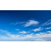 Blue clear sky with white cirrus spindrift clouds background