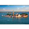 Famous Italy tourist destination - aerial view of Venice lagoon and San Giorgio di Maggiore church with boats and vaporetto traffic on sunset from St Mark's Campanile bell tower, Venice, Italy