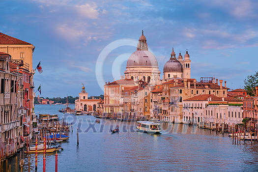 View of Venice Grand Canal with boats and Santa Maria della Salute church on sunset from Ponte dell'Accademia bridge. Venice, Italy View of Venice Grand Canal with boats and Santa Maria della Salute church on sunset from Ponte dell'Accademia bridge. Venice, Italy