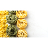 Different types of raw pasta, copyspace.