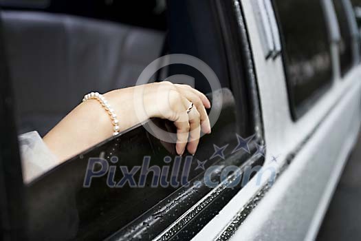 Brides hand on the car window Brides hand on the car window
