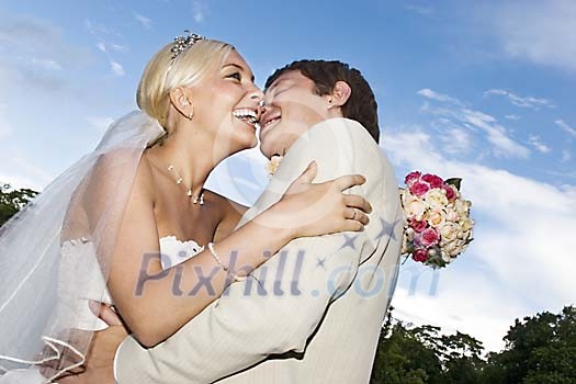 Bride and groom hugging Bride and groom hugging