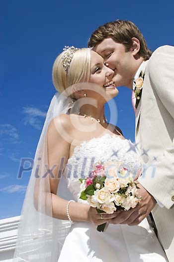 Bride and groom in sunshine Bride and groom in sunshine