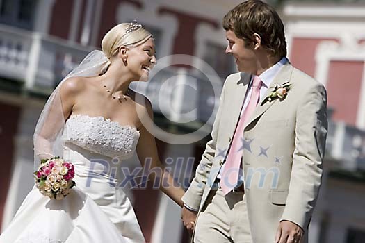 Happy couple holding hands Happy couple holding hands