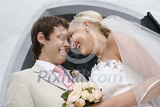 Bride and groom in front of a church Bride and groom in front of a church