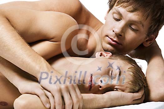 Man looking as his partner sleeps Man looking as his partner sleeps