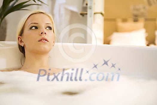Woman relaxing in the bath Woman relaxing in the bath
