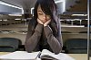 Woman sitting in the classroom and reading