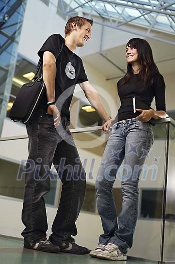 Boy and a girl talking in the hallway Boy and a girl talking in the hallway