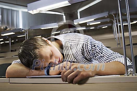 Boy sleeping in the classroom Boy sleeping in the classroom