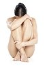 Naked woman sitting on the ground
